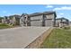Attractive three-car garage home with stone accents and a long driveway at 5723 Berry Ridge Way, Castle Rock, CO 80104