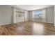 Spacious living room featuring natural light and wood floors at 5723 Berry Ridge Way, Castle Rock, CO 80104
