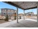 Covered patio featuring string lights, offering an outdoor living space with a view of the neighborhood at 5723 Berry Ridge Way, Castle Rock, CO 80104