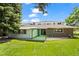 A lush backyard featuring a covered patio and vibrant green lawn at 3631 W 79Th Ave # A2, Westminster, CO 80030