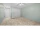 Bedroom with plush carpet, a ceiling fan, closet with doors and entrance doors at 3631 W 79Th Ave # A2, Westminster, CO 80030