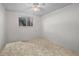 Bright bedroom featuring neutral carpet and a window overlooking an outdoor stairway at 3631 W 79Th Ave # A2, Westminster, CO 80030