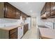 Well-maintained kitchen with ample cabinet space, white appliances, and tiled floor, perfect for cooking at 3631 W 79Th Ave # A2, Westminster, CO 80030