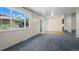 Open-concept living room with new carpet, slider to backyard and lots of natural light at 3631 W 79Th Ave # A2, Westminster, CO 80030