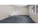 Bright living room features new carpet, a front door, and a window at 3631 W 79Th Ave # A2, Westminster, CO 80030