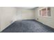 Spacious living room features new carpet, a front door, and a window at 3631 W 79Th Ave # A2, Westminster, CO 80030