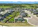 Aerial view of the property highlighting its location within a well-planned neighborhood with landscaped yards and mature trees at 918 Honey Berry Ct, Elizabeth, CO 80107