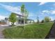 Expansive backyard featuring a covered patio and lush green lawn, perfect for outdoor entertaining and relaxation at 918 Honey Berry Ct, Elizabeth, CO 80107