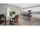 Bright kitchen with a breakfast bar and a dining area with sliding glass doors to backyard at 918 Honey Berry Ct, Elizabeth, CO 80107