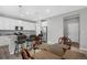 Open concept kitchen/dining area, featuring modern white cabinets and stainless steel appliances at 918 Honey Berry Ct, Elizabeth, CO 80107