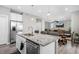Bright, open-concept kitchen with modern fixtures and an island with granite countertops at 918 Honey Berry Ct, Elizabeth, CO 80107