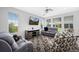 Comfortable living room with large windows and modern furniture at 918 Honey Berry Ct, Elizabeth, CO 80107
