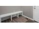 Mud room area with a built-in bench, coat hooks, and durable flooring at 918 Honey Berry Ct, Elizabeth, CO 80107