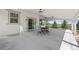 The outdoor patio features a concrete floor, ceiling fans, and space for seating at 918 Honey Berry Ct, Elizabeth, CO 80107