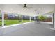 Large covered patio with ceiling fans and an outdoor dining area at 918 Honey Berry Ct, Elizabeth, CO 80107