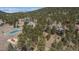Aerial view of the property, neighborhood, and mountainous scenery in the background at 4192 Timbervale Dr, Evergreen, CO 80439