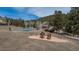 Aerial view of the community park, playground, and tennis courts at 4192 Timbervale Dr, Evergreen, CO 80439