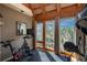 Bright exercise room with great natural light, a view and plenty of room for any workout equipment at 4192 Timbervale Dr, Evergreen, CO 80439