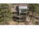 Stunning multi-level deck with outdoor seating in a serene, wooded setting, perfect for relaxing and entertaining at 4192 Timbervale Dr, Evergreen, CO 80439