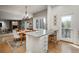 Lovely kitchen featuring a granite island and connection to the dining room at 4192 Timbervale Dr, Evergreen, CO 80439