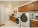 Laundry room featuring a washer and dryer, as well as extra storage space at 4192 Timbervale Dr, Evergreen, CO 80439
