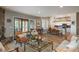 Open-concept living area flows seamlessly into the kitchen and dining space, perfect for entertaining at 4192 Timbervale Dr, Evergreen, CO 80439