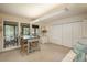 Bright living room with a walkout to a deck, neutral paint colors, and lots of closet space at 4192 Timbervale Dr, Evergreen, CO 80439