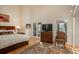 Bright main bedroom with vaulted ceilings, ample light, and adjacent balcony at 4192 Timbervale Dr, Evergreen, CO 80439