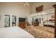 Large main bedroom with vaulted ceilings and mirrored closets with a private balcony at 4192 Timbervale Dr, Evergreen, CO 80439