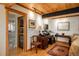 Comfortable office area with adjacent temperature controlled wine storage at 4192 Timbervale Dr, Evergreen, CO 80439
