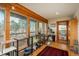Sun room with wood ceilings, natural light, and views of the neighborhood at 4192 Timbervale Dr, Evergreen, CO 80439