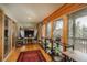 Bright sun room with wood ceilings, neutral paint colors, and views of nature at 4192 Timbervale Dr, Evergreen, CO 80439