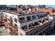An aerial view of the building showcases the patios, balconies, and rooftop terrace at 1435 Wazee St # 403, Denver, CO 80202