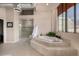 Relaxing bathroom with large soaking tub, walk-in shower, and natural light at 1435 Wazee St # 403, Denver, CO 80202