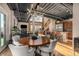 Bright dining room featuring modern lighting, an open floor plan, and access to stairs at 1435 Wazee St # 403, Denver, CO 80202