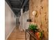Elegant hallway with hardwood floors, decorative accents, and exposed piping offering a refined aesthetic at 1435 Wazee St # 403, Denver, CO 80202
