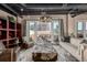 Stylish living room with exposed ductwork, a designer coffee table, and access to an outdoor patio at 1435 Wazee St # 403, Denver, CO 80202