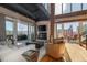 Cozy living room featuring a fireplace, outdoor patio, exposed ductwork, and lots of natural light at 1435 Wazee St # 403, Denver, CO 80202