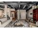 Inviting living room with hardwood floors, exposed ceiling ductwork, and a rustic wooden coffee table at 1435 Wazee St # 403, Denver, CO 80202