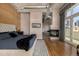 Spacious main bedroom with fireplace, hardwood floors, and balcony access with city views at 1435 Wazee St # 403, Denver, CO 80202