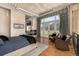 Spacious main bedroom with fireplace, hardwood floors, and balcony access with city views at 1435 Wazee St # 403, Denver, CO 80202
