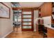 Office area with storage and wood sliding door, adding privacy to the workspace at 1435 Wazee St # 403, Denver, CO 80202