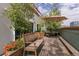 Inviting rooftop patio featuring beautiful foliage, planters, and outdoor seating with a wooden bench and shade at 1435 Wazee St # 403, Denver, CO 80202