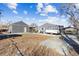 Backyard view showcasing detached garage and open area at 8520 W 32Nd Pl, Wheat Ridge, CO 80033