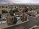 Aerial view of this house in a lush suburban neighborhood with mountain views in the distance at 1808 Southard St, Erie, CO 80516