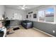 Comfortable bedroom featuring a ceiling fan, window and a couch for a relaxing atmosphere at 1808 Southard St, Erie, CO 80516