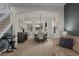 Elegant dining room with seating for six, opening into a living room with abundant natural light at 1808 Southard St, Erie, CO 80516