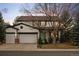 Charming two-story home featuring a well-maintained front yard and an attached two-car garage at 1808 Southard St, Erie, CO 80516