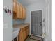 Well-lit mud room with storage cabinets, a utility sink, and backyard access at 1808 Southard St, Erie, CO 80516