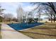 Community playground with swings and a slide in a fenced area near a walking path and tennis court at 1808 Southard St, Erie, CO 80516